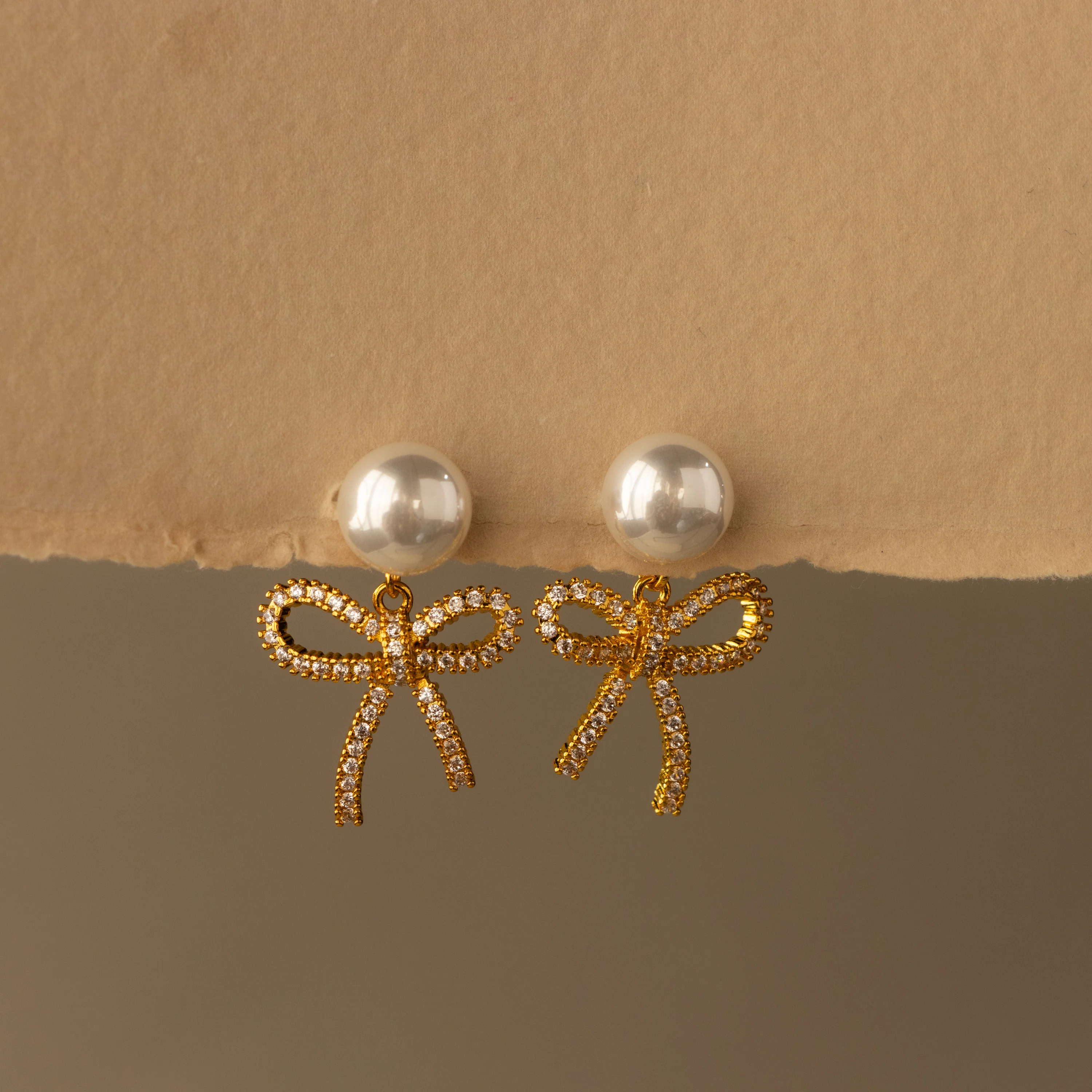 Pearl Dangling Pave Bow Studs