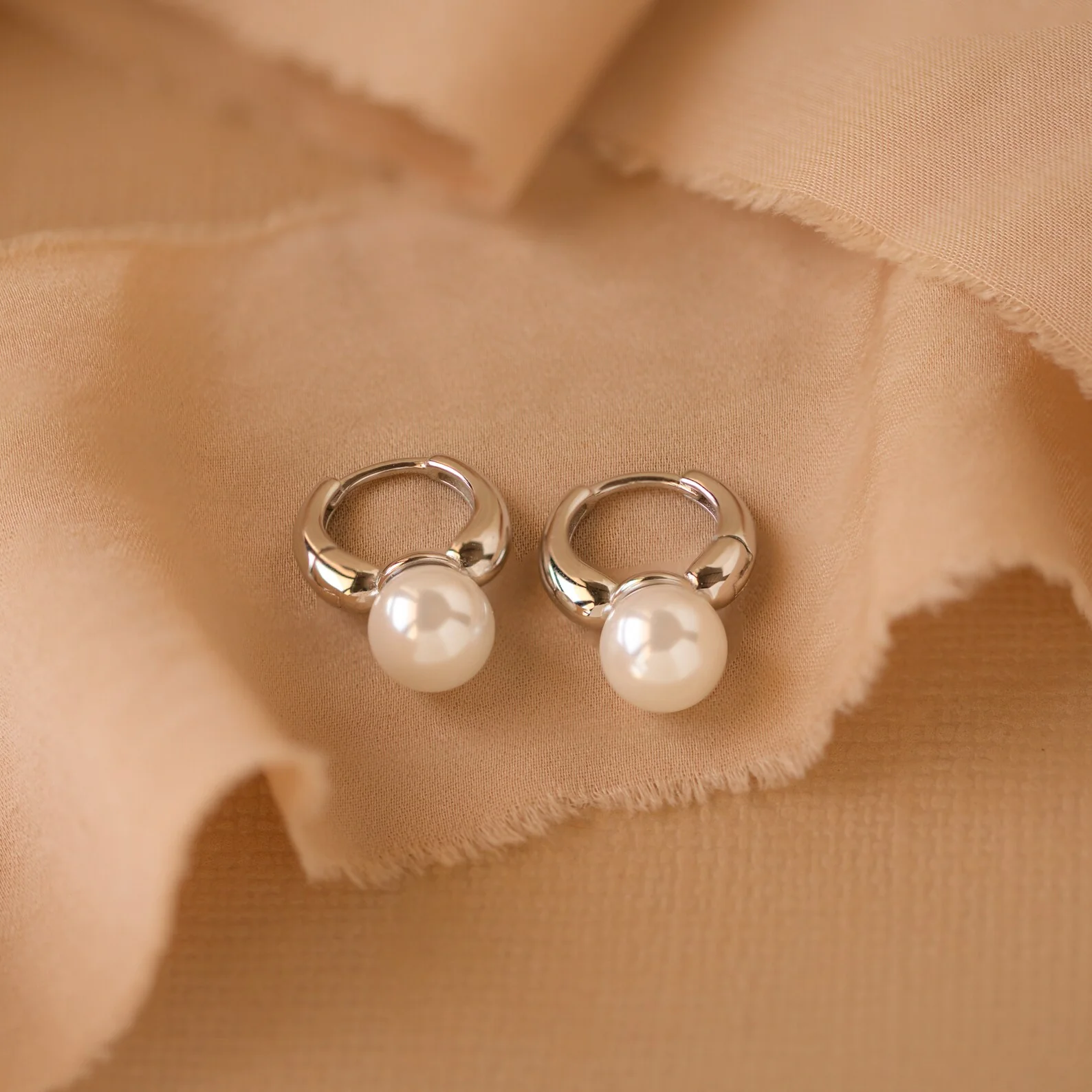 Pearl Drop Huggies in Silver